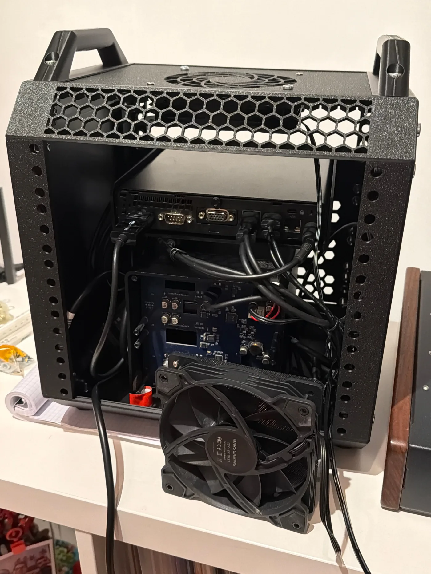 Open mini-ITX case mid-build, showing motherboard and cabling